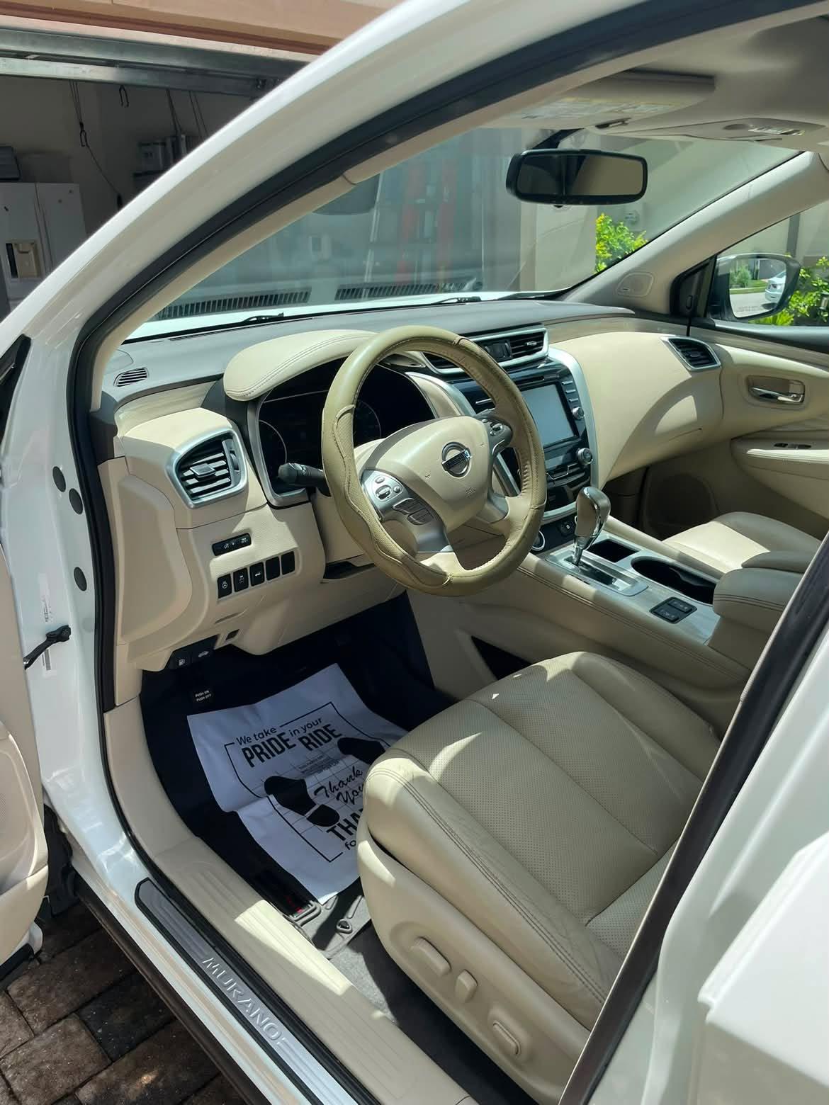 Detailed Nissan Murano interior with cream leather seats
