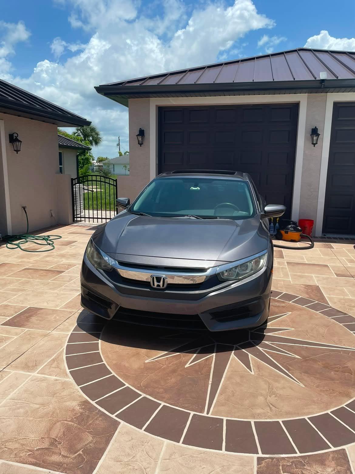 Freshly washed Honda Civic on a driveway